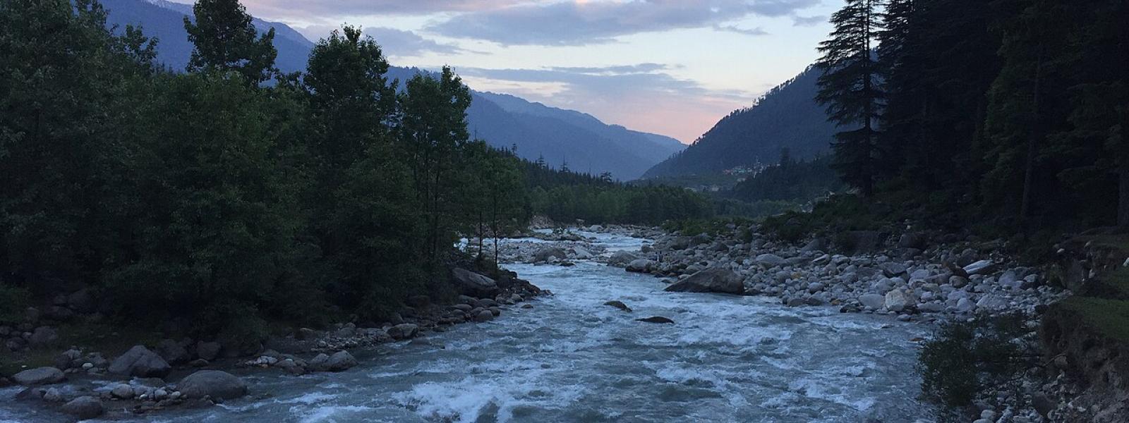 flowing river with stillness of the mountains 
