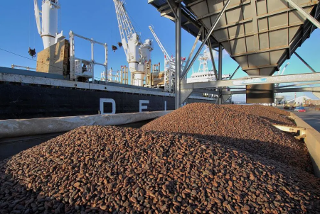transporting goods - blue sky - machinery with brown contents